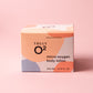 Truly O2 micro-oxygen body lotion box in front of salmon background